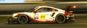 Porsche race car racing on track